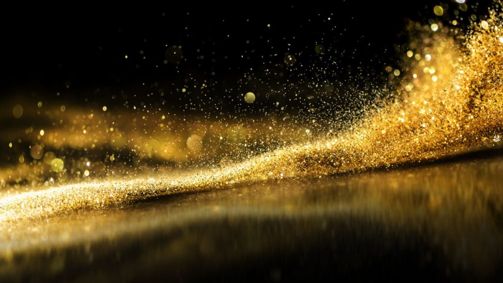 gold sparkles black background