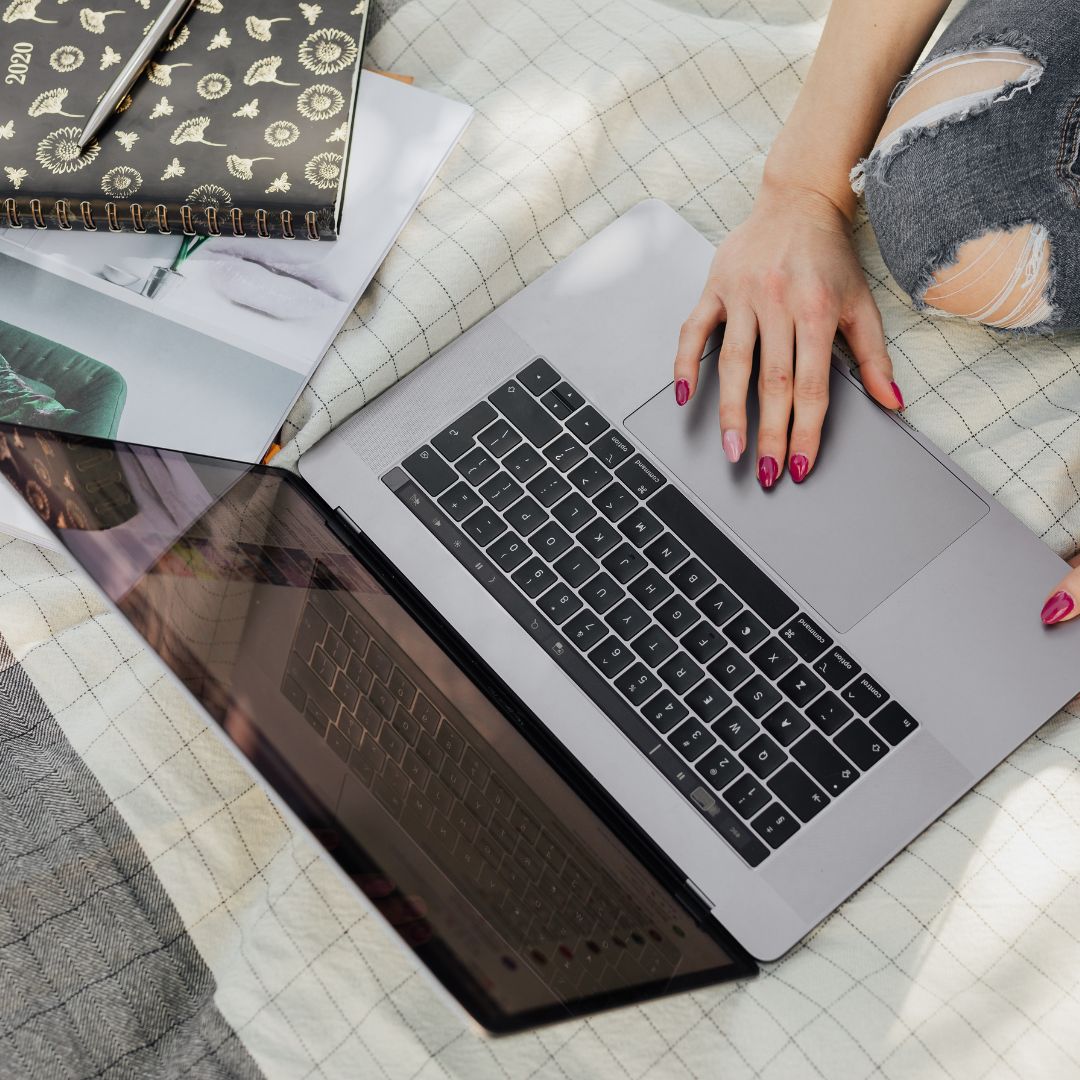 a young woman doing research on a laptop