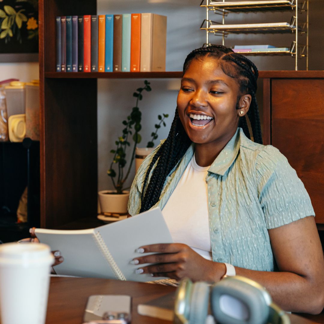 a young woman looking through paper work